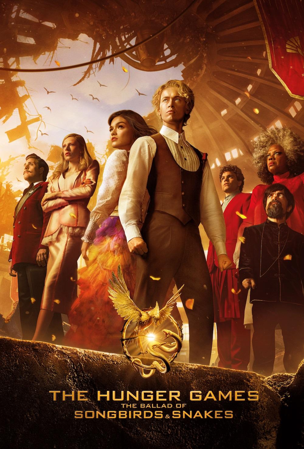 Several people standing around and looking up in dramatic fashion, with a golden hue overlaying it all.